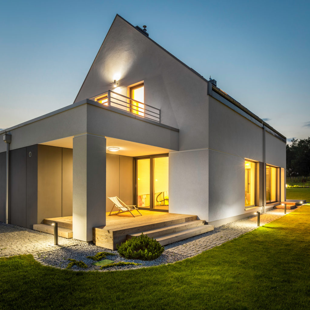 Night external view of a contemporary house with outdoor lighting